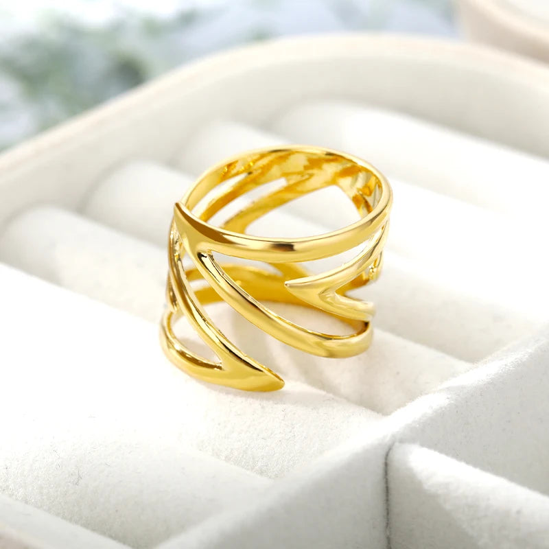 “Sculpted Wave Statement Ring”