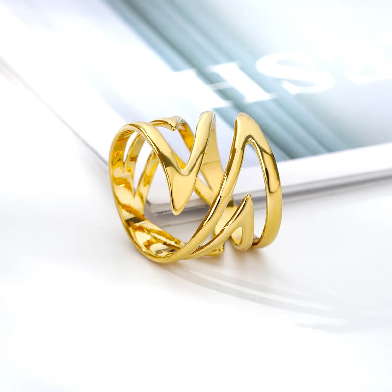 “Sculpted Wave Statement Ring”