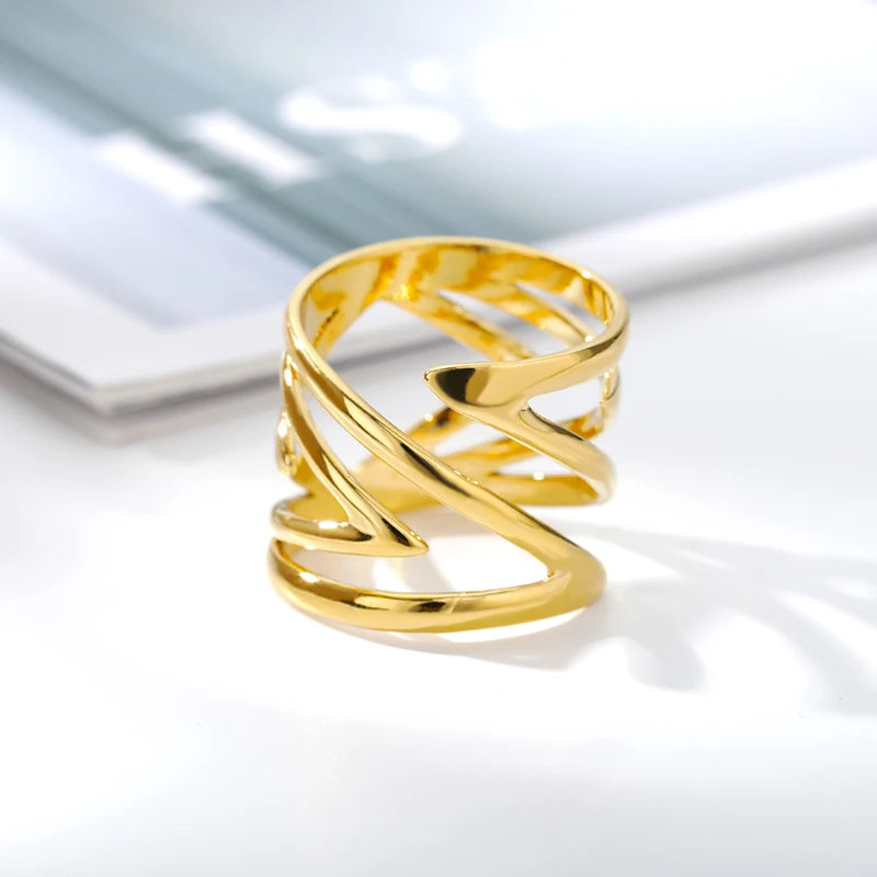 “Sculpted Wave Statement Ring”