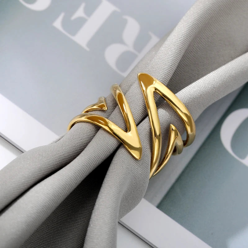 “Sculpted Wave Statement Ring”